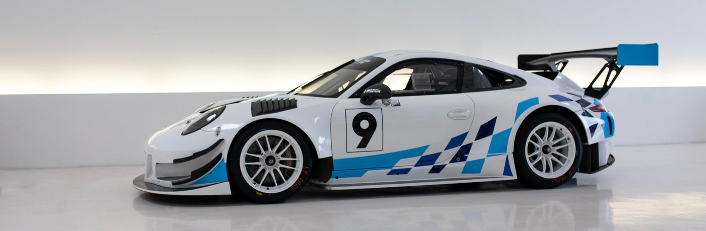 White Porsche GT3R with blue two tone checker flag livery